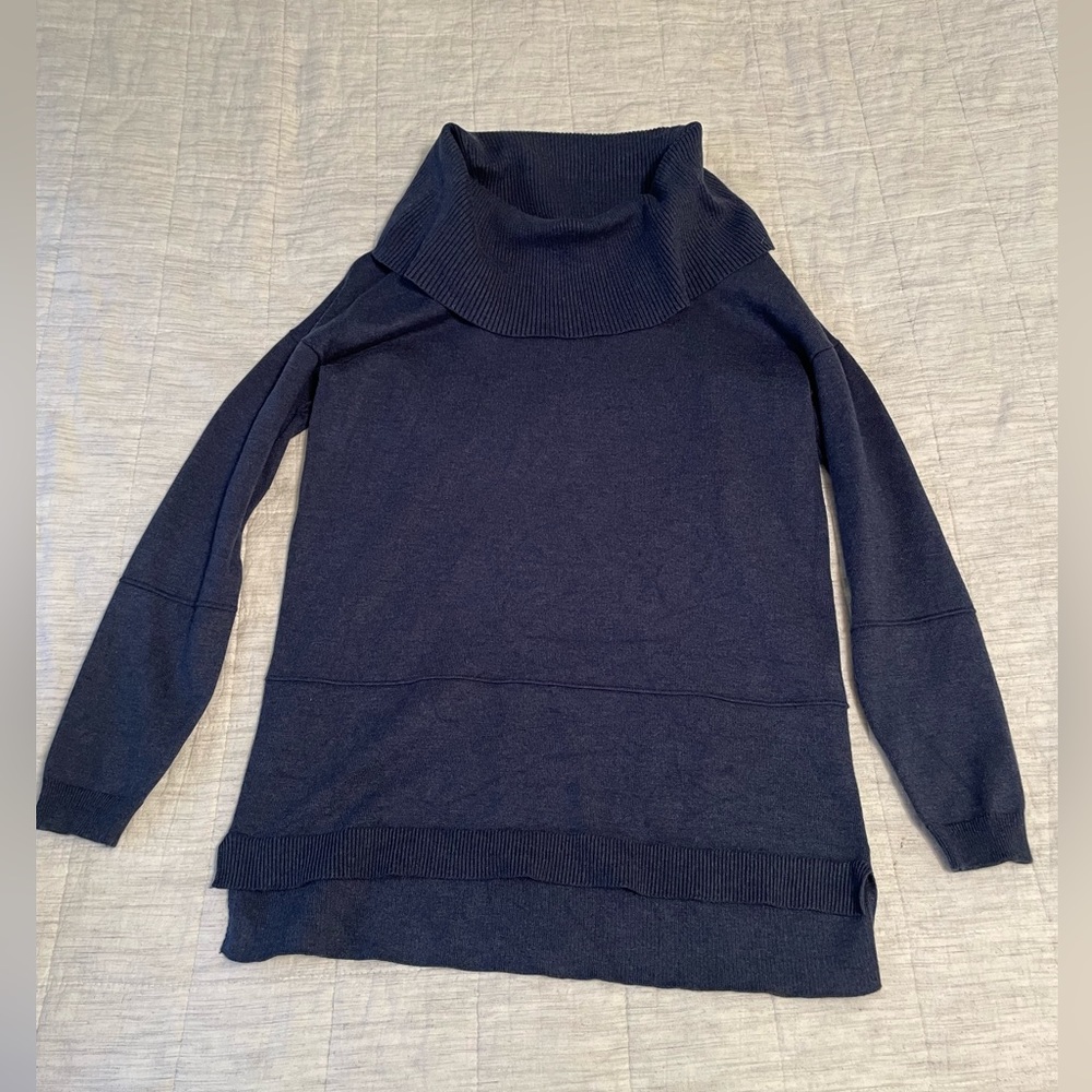 Blue turtle neck sweater, slightly worn.
